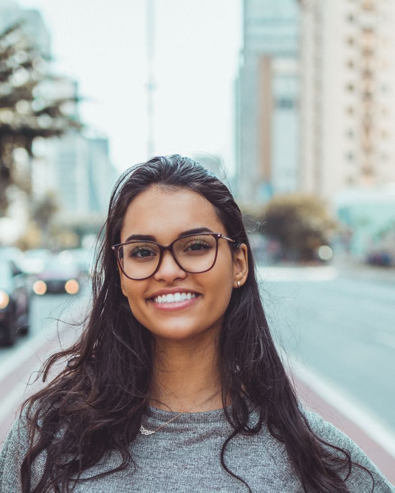 Illustrative stock portrait for sample profile — not a photograph of Sarah Khan